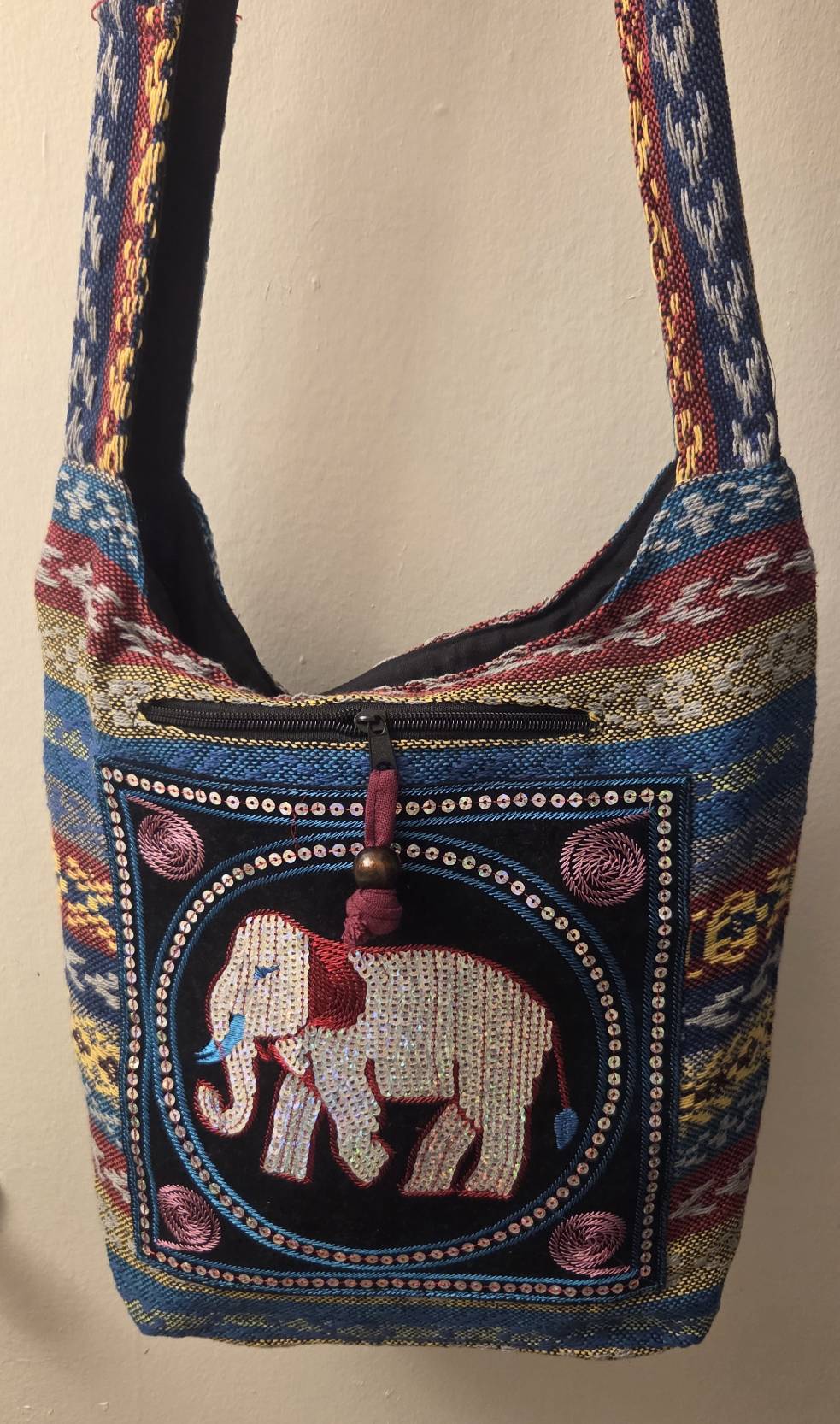 Thai Elephant Sequin Crossbody Bag – front view with iridescent sequin elephant panel and decorative zipper pull