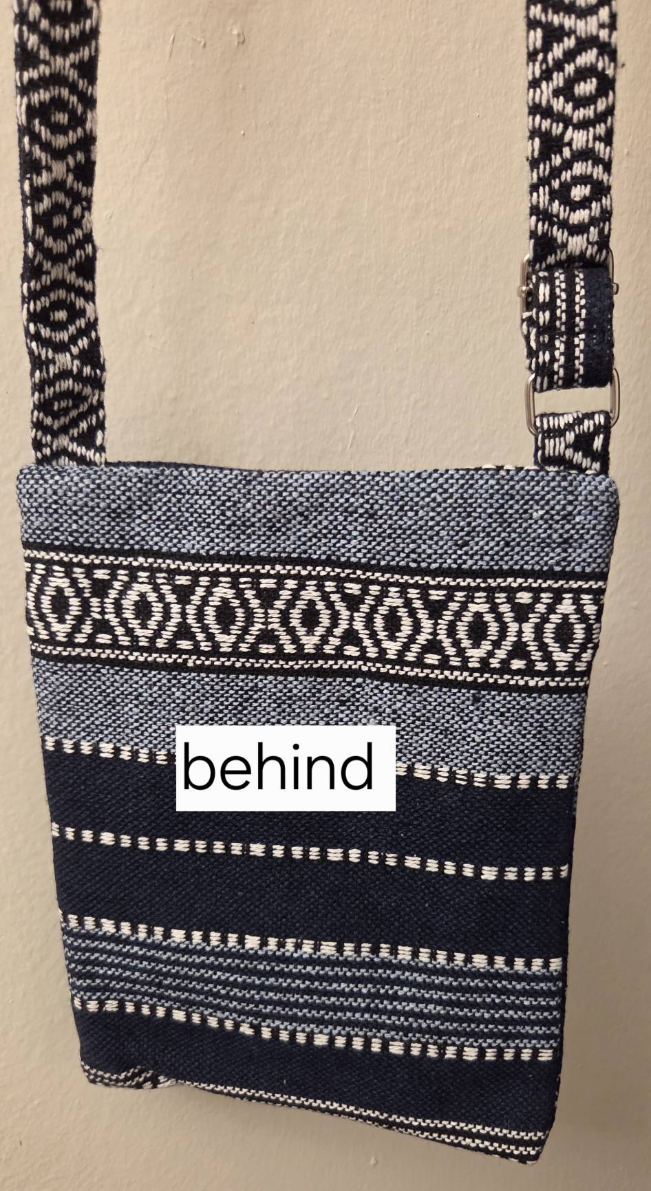 Thai woven crossbody bag flat lay with travel accessories