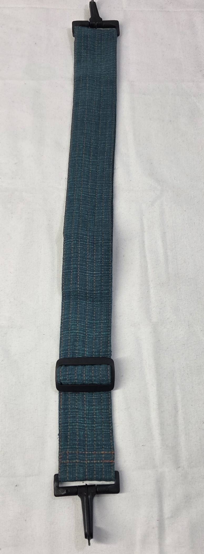 Thai cotton boho tote bag ET-05 – teal body with earth tone geometric woven bottom panel, lifestyle with plants
