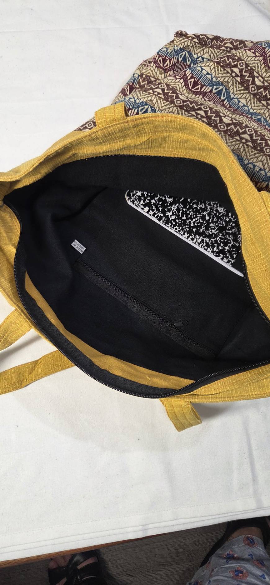 Thai cotton boho tote bag ET-06 – mustard yellow body with brown aztec geometric woven panel, detachable crossbody strap, lifestyle hanging shot with ivy plant