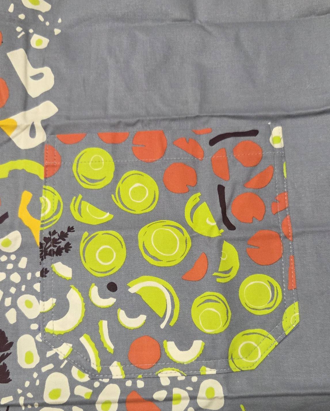 Hell of a Lot Apron - pocket detail veggie print closeup