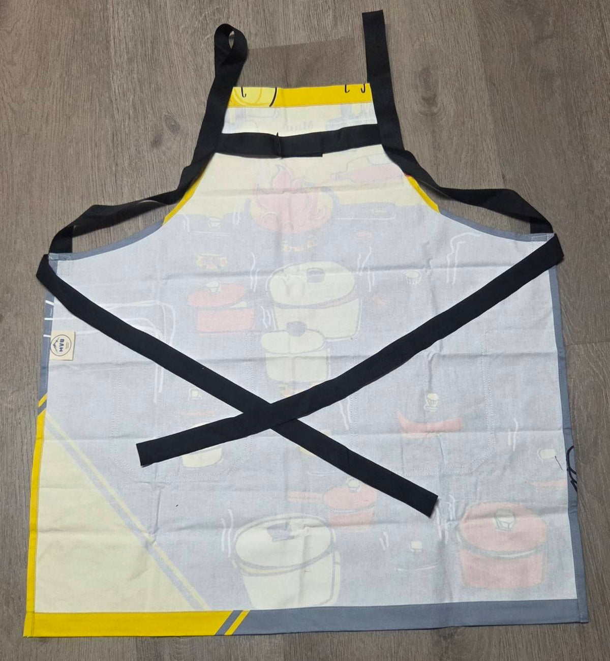 Man with a Pan Apron - print detail pots and pans