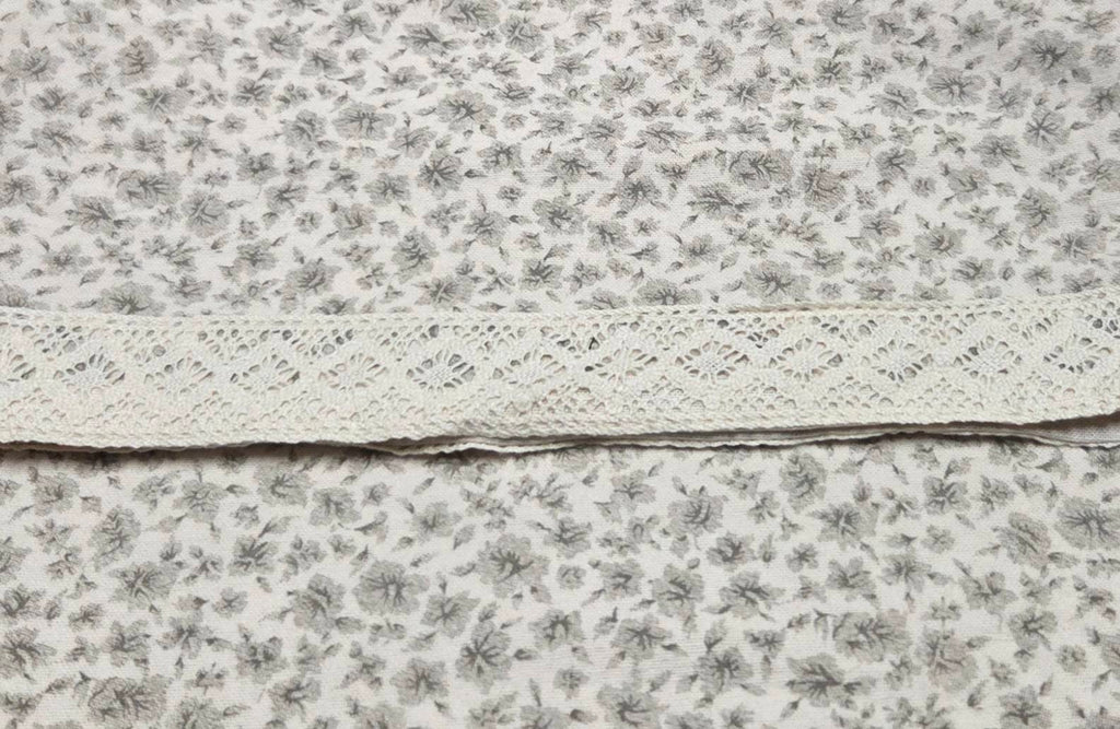 Close-up of gray floral print and cream lace on LP-010 pajama pants