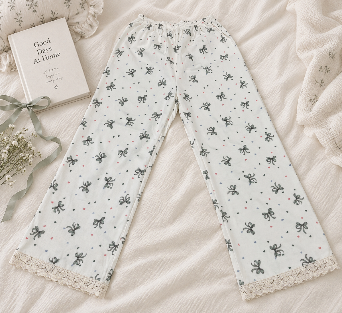 Model wearing LP-04 ivory bow and heart straight-leg pajama pants