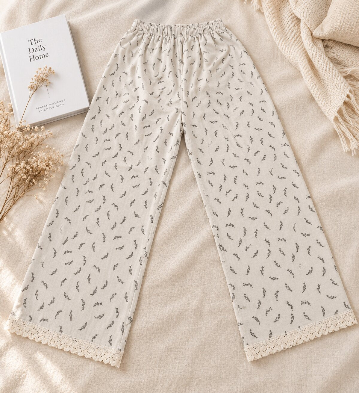 Model wearing LP-08 ivory botanical sprig straight-leg pajama pants