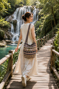 Thai woven shoulder bag BC-07 - lifestyle editorial model at waterfall bridge